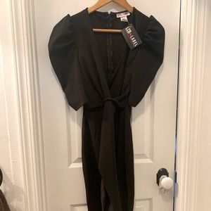 Black dress, low v neck line with puffed sleeves